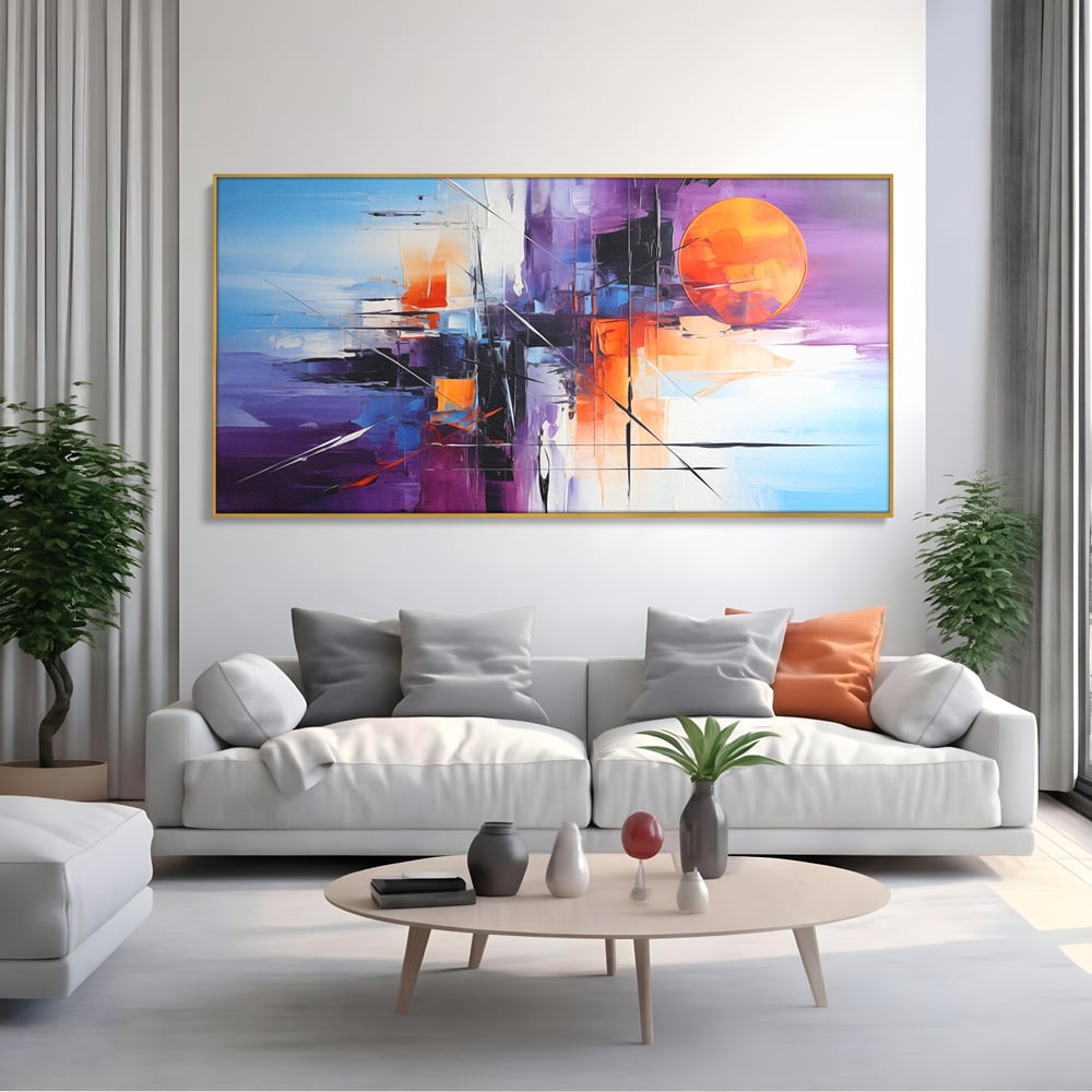 Tablou canvas cu pictura abstracta cu soare portocaliu, in rama de aluminiu auriu, pe perete intr-un living